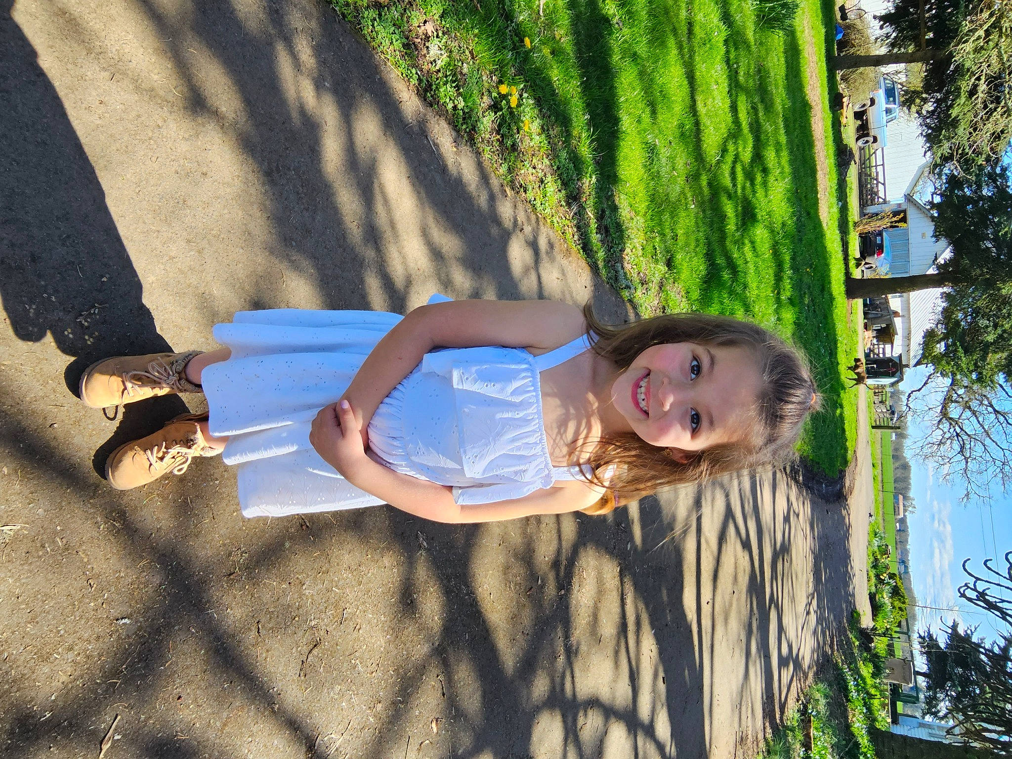 Rosalie is registered to the contest to win money with this photo: electric_blue, flash_photography, fun, grass, happy, human_leg, joy, leaf, leisure, people_in_nature, person, plant, recreation, sitting, smile, sunlight, t_shirt, tints_and_shades, toddler, tree