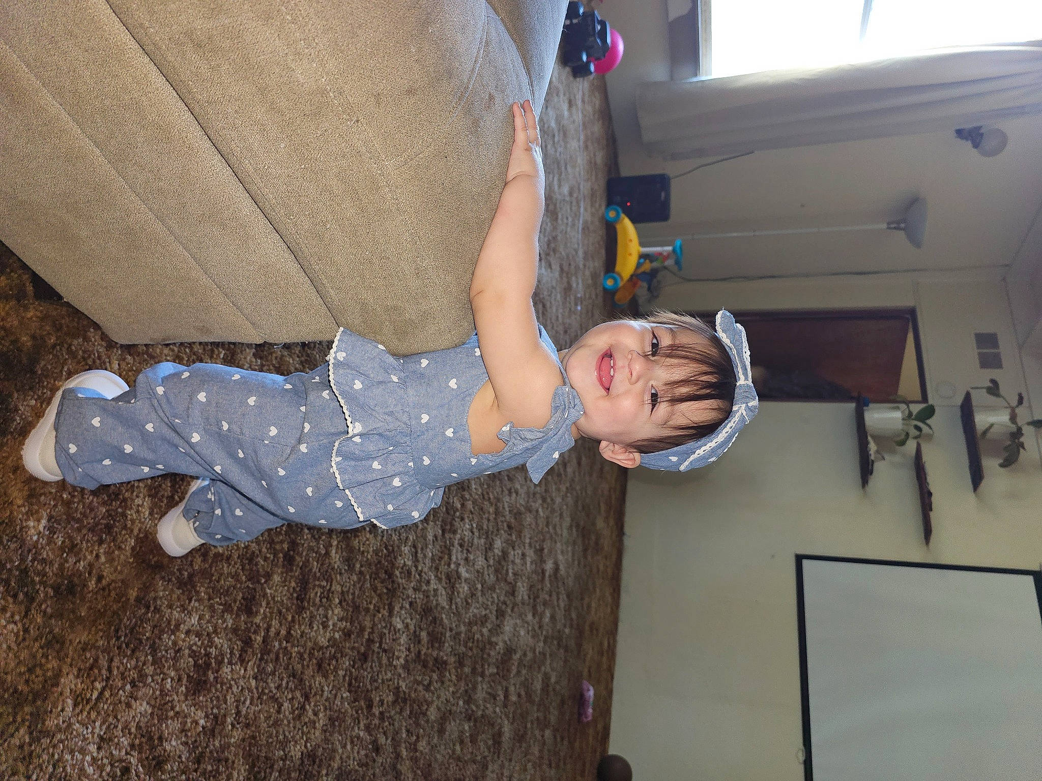 Reina joined the competition — help win amazing prizes! baby_toddler_clothing, balance, child, comfort, elbow, flooring, fun, human_leg, joy, knee, leg, person, room, sitting, sock, thigh, toddler, wood, wrist