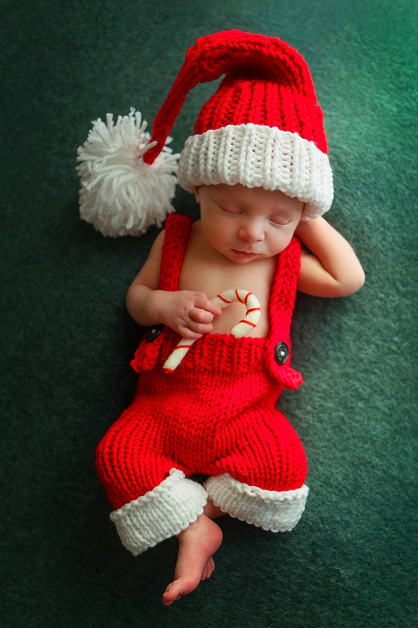 Archer is registered to the contest to win money with this photo: baby, baby_toddler_clothing, cap, child, craft, dress, fashion_accessory, flooring, hand, hat, headgear, headwear, knit_cap, outerwear, pattern, person, skin, sleeve, sock, toddler