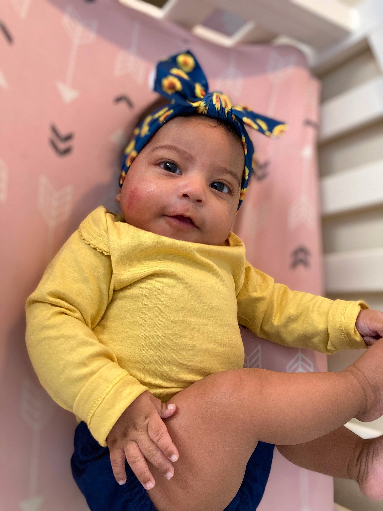 Raelynn is registered to the contest to win money with this photo: abdomen, baby, baby_toddler_clothing, chair, child, comfort, elbow, eye, finger, fun, gesture, happy, human_leg, knee, leisure, person, skin, thigh, thumb, toddler