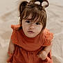 toddler, child, portrait, face, hair, pigtails, dress, orange, sitting, sand, outdoor, curious, innocent, baby, young_child, cute, closeup, expression, skin, person