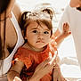 Solena a rejoint le concours — aidez-le/la à gagner de superbes lots ! toddler, child, family, adult, woman, man, orange_dress, pigtails, hands, close_up, outdoor, sunlight, skin, portrait, caring, love, gentle, expression, warm_light, sitting