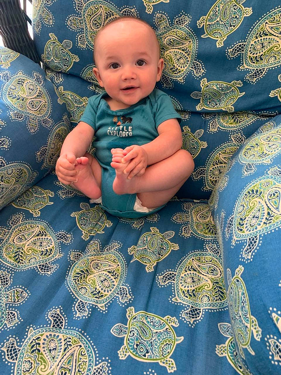 Kieran joined the competition — help win amazing prizes! aqua, azure, baby, baby_toddler_clothing, black, comfort, electric_blue, eye, face, flash_photography, flooring, happy, head, linens, pattern, person, purple, smile, textile, toddler