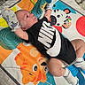 Silver joined the competition — help win amazing prizes! baby, infant, nike, onesie, mittens, socks, play_mat, animal_print, oxygen_tube, floor, colorful, toddler, cute, lying_down, indoor, toy, pacifier, healthcare, child, person