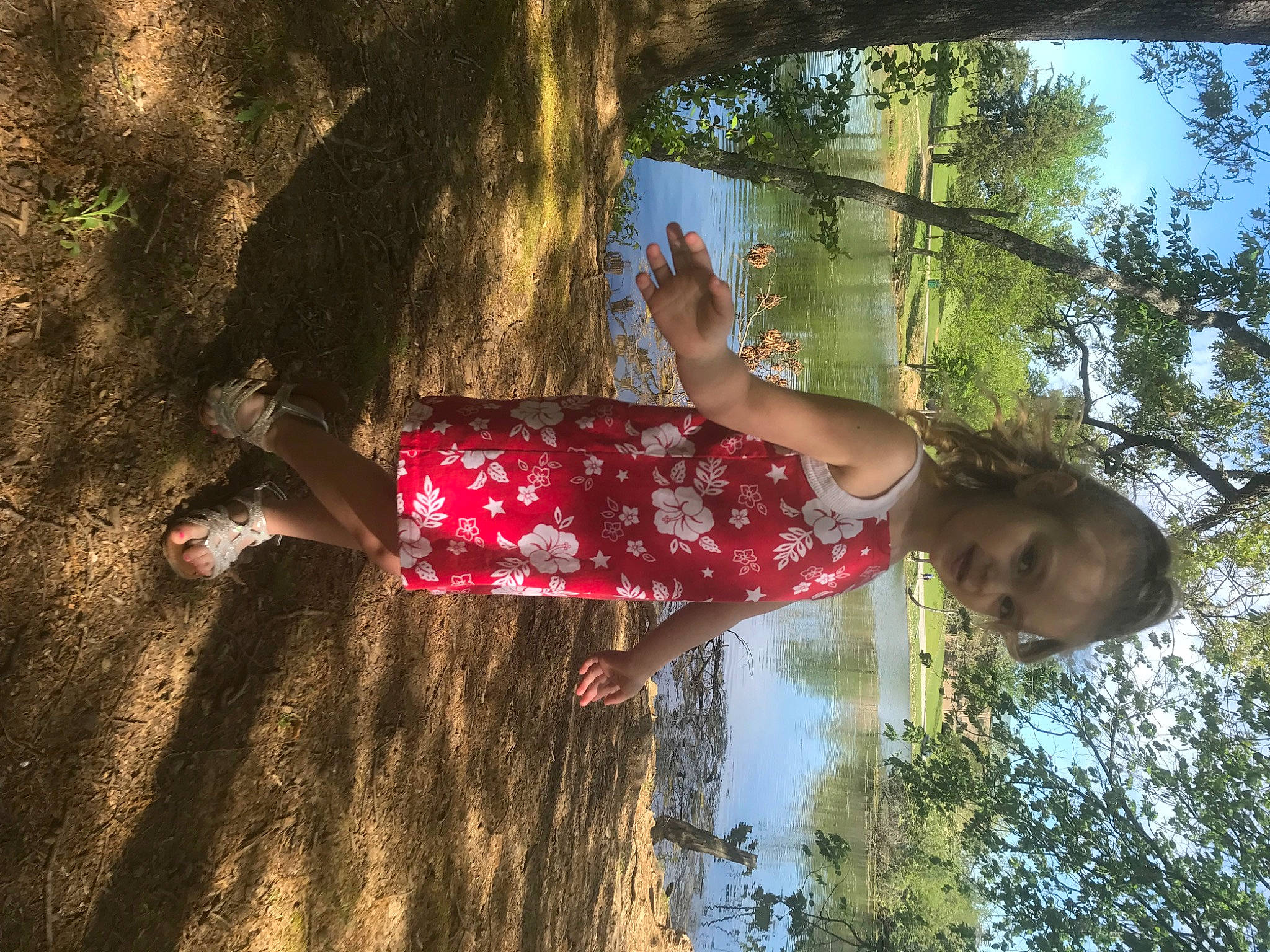 Isabella is registered to the contest to win money with this photo: branch, child, fun, grass, happy, leaf, leisure, nature, people_in_nature, person, plant, reflection, sky, sunlight, tints_and_shades, toddler, tree, trunk, twig, wood