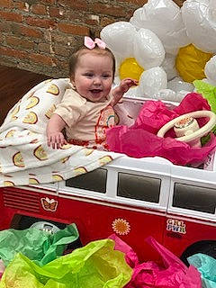 Evie joined the competition — help win amazing prizes! baby, baby_products, baby_toddler_clothing, balloon, child, event, fun, happy, magenta, party_supply, person, petal, photograph, pink, product, smile, snapshot, sweetness, textile, toddler