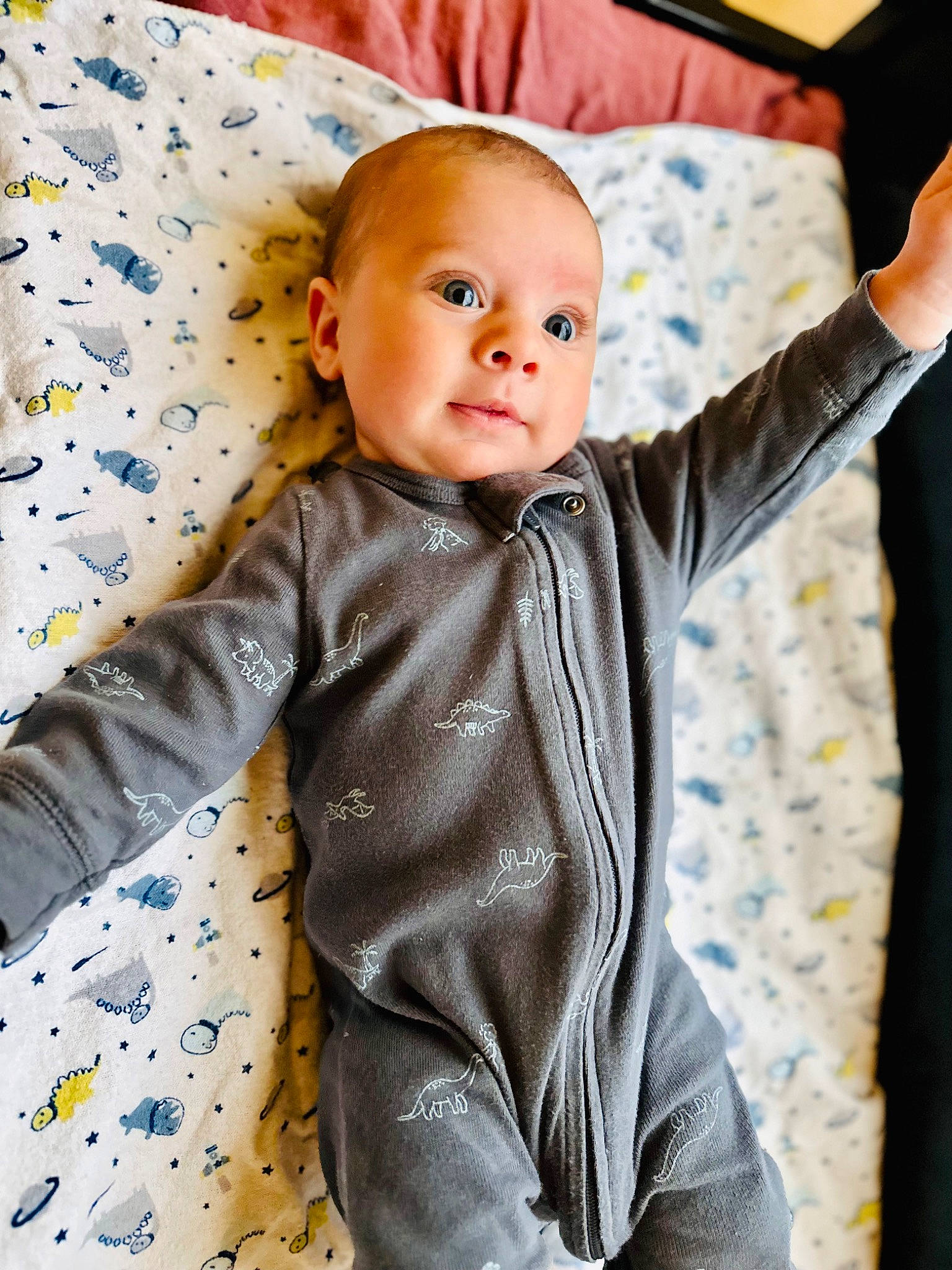 Carter is registered to the contest to win money with this photo: baby, baby_toddler_clothing, child, collar, comfort, dress_shirt, formal_wear, gesture, happy, linens, outerwear, pattern, person, product, sitting, skin, sleeve, standing, t_shirt, textile