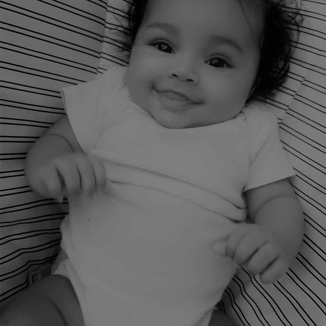 Cai'Lynn joined the competition — help win amazing prizes! baby, bed, bodypart, couch, cradle, crib, face, finger, furniture, hand, happy, head, infantbed, mouth, newborn, person, photography, portrait, sitting, smile