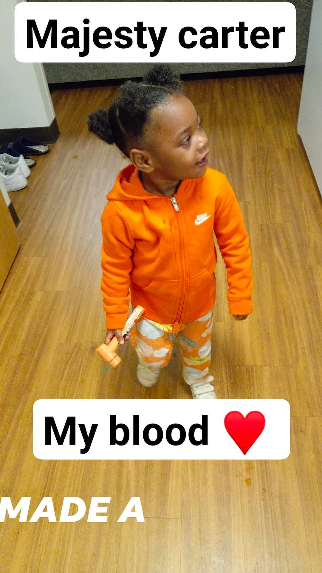 Majesty Carter joined the competition — help win amazing prizes! baby, baby_toddler_clothing, child, floor, flooring, font, gesture, happy, hardwood, logo, orange, person, photo_caption, sleeve, t_shirt, thumb, toddler, varnish, wood, wood_flooring