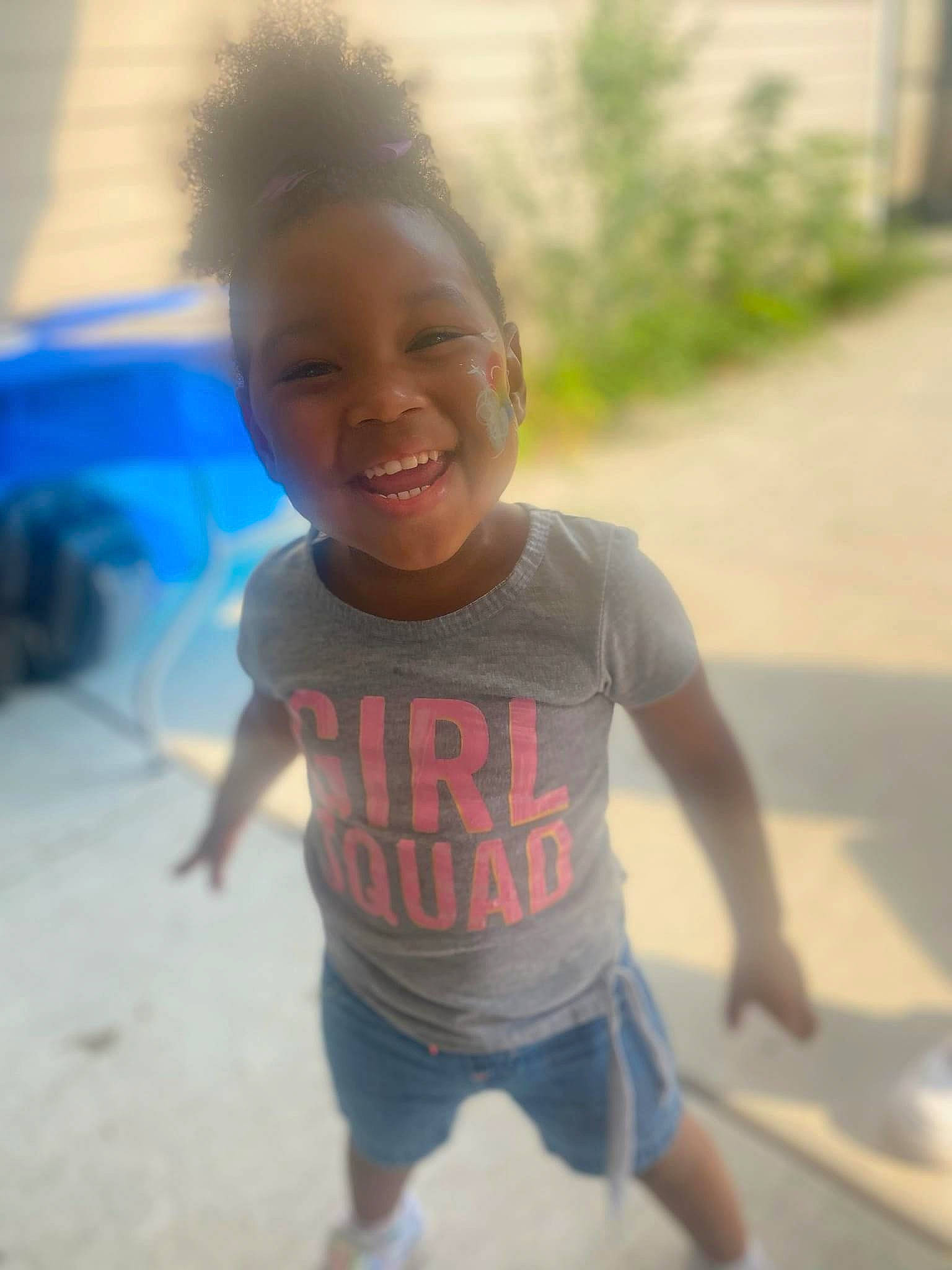 Miracle is registered to the contest to win money with this photo: asphalt, chest, child, cool, electric_blue, eye, face, fun, grass, happy, joy, leisure, person, recreation, road, shoulder, skin, sleeve, smile, t_shirt