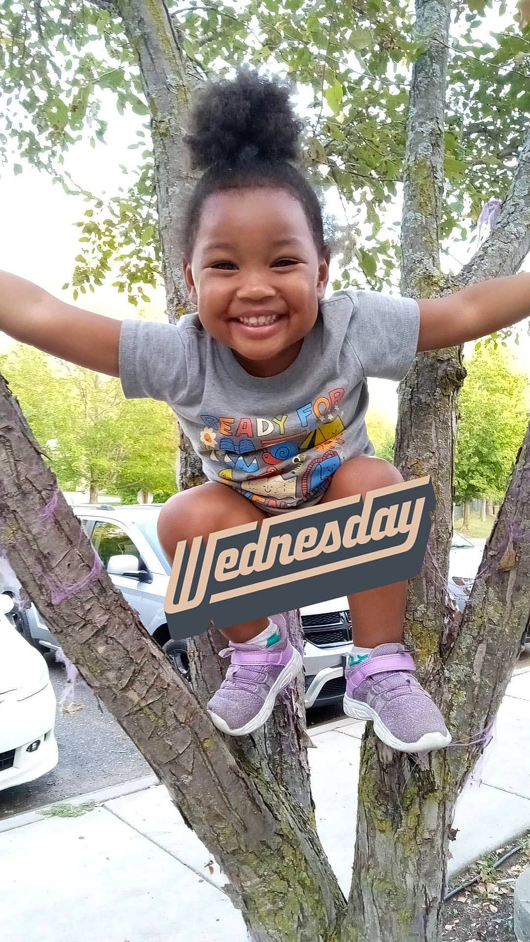 Miracle is registered to the contest to win money with this photo: automotive_tire, automotive_wheel_system, child, cool, fun, grass, happy, joy, leisure, motor_vehicle, person, plant, recreation, shoe, smile, sneakers, soil, t_shirt, toddler, tree