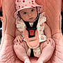 Marnie-Mai is registered to the contest to win money with this photo: baby, bodypart, bonnet, car, car_interior, carseat, clothing, dress, face, finger, hand, hat, head, person, photography, portrait, sitting, sunhat, transportation, vehicle