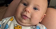 Pierce is registered to the contest to win money with this photo: baby, infant, face, drool, onesie, cookie_monster, cookie, clothing, indoor, portrait, child, cute, smile, skin, head, person, happy, expression, eyes, babywear