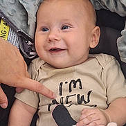 Pierce joined the competition — help win amazing prizes! baby, infant, smiling, face, hand, finger, shirt, text, plush_toy, blanket, clothing, cute, child, portrait, happy, sitting, indoor, skin, head, person