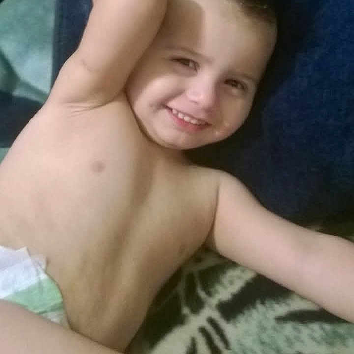 Nathaniel joined the competition — help win amazing prizes! arm, bare_chest, blanket, candid, casual, child, comfort, diaper, face, gesture, hair_spiked, happy, indoor, lying_down, person, relaxed, skin, smiling, toddler, young_child