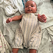 Giuseppe joined the competition — help win amazing prizes! baby, bed, blanket, child, comfort, cute, floral_pattern, footwear, indoors, infant, lying_down, person, portrait, relaxed, romper, sheet, skin, sleepwear, socks, soft_texture