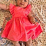 éléa participe au concours pour gagner de l'argent avec cette photo : baby, infant, child, pink_dress, lying_down, blanket, patterned_blanket, smiling, happy, cute, portrait, face, arms, legs, skin, indoors, soft_light, young_child, comfortable, relaxed