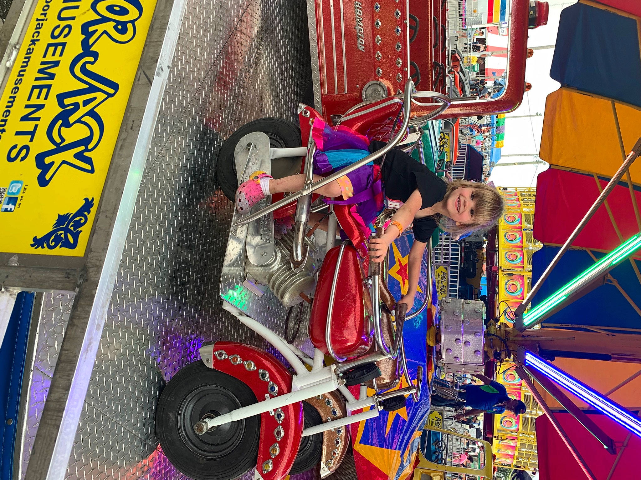 Adalynn Harvey joined the competition — help win amazing prizes! advertising, art, artist, auto_part, automotive_design, automotive_tire, automotive_wheel_system, city, electrical_supply, engineering, event, joy, machine, magenta, motor_vehicle, person, recreation, spoke, tire, vehicle