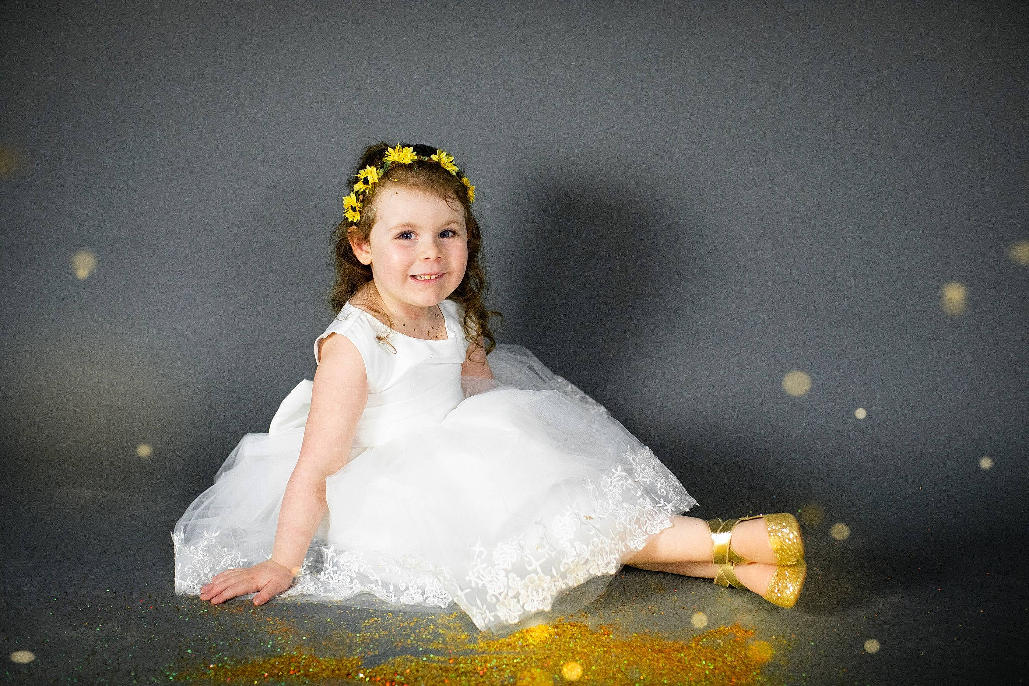 Macy is registered to the contest to win money with this photo: bridal_accessory, bride, ceremony, child, child_model, costume, dress, flash_photography, fun, gown, hair_accessory, happy, headpiece, joy, person, photograph, photography, portrait, sitting, smile