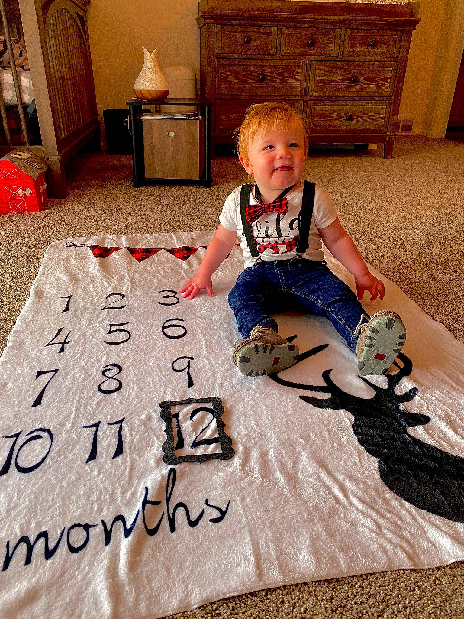 Kaden joined the competition — help win amazing prizes! cabinetry, chest_of_drawers, child, comfort, cupboard, drawer, floor, flooring, font, happy, hardwood, lamp, people, person, room, sleeve, smile, snapshot, t_shirt, toddler