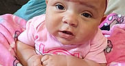 Shalyssa is registered to the contest to win money with this photo: baby, blanket, child, closeup, clothing, comfortable, couch, cute, expression, face, hands, headwear, indoors, infant, person, pink_headband, portrait, resting, soft_fabric, toddler