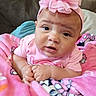 baby, blanket, child, closeup, clothing, comfortable, couch, cute, expression, face, hands, headwear, indoors, infant, person, pink_headband, portrait, resting, soft_fabric, toddler