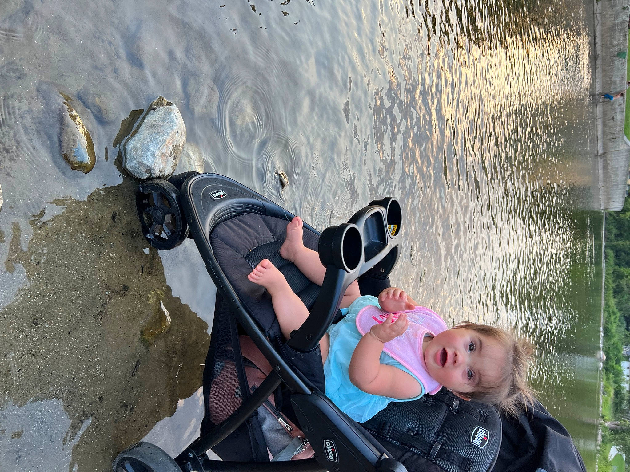 Amiyah joined the competition — help win amazing prizes! adventure, baby_carriage, baby_products, boats_and_boating_equipment_and_supplies, child, eyewear, fun, human_leg, lake, leisure, person, personal_protective_equipment, photograph, recreation, reflection, shadow, sitting, toddler, travel, vacation