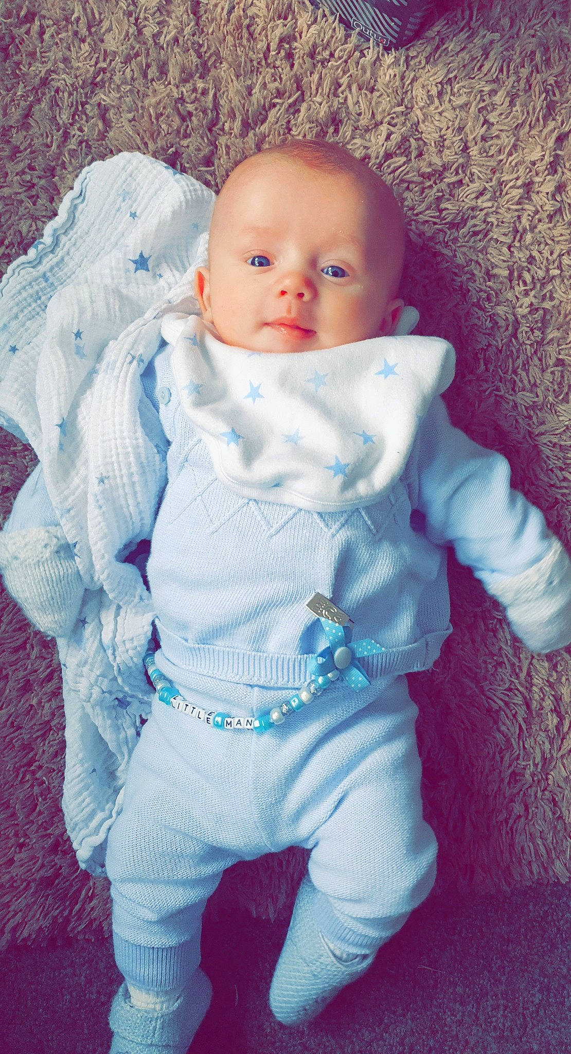 Louie is registered to the contest to win money with this photo: azure, baby, baby_toddler_clothing, cheek, eye, face, finger, gesture, happy, head, iris, lip, mouth, neck, nose, person, pink, skin, sleeve, toddler