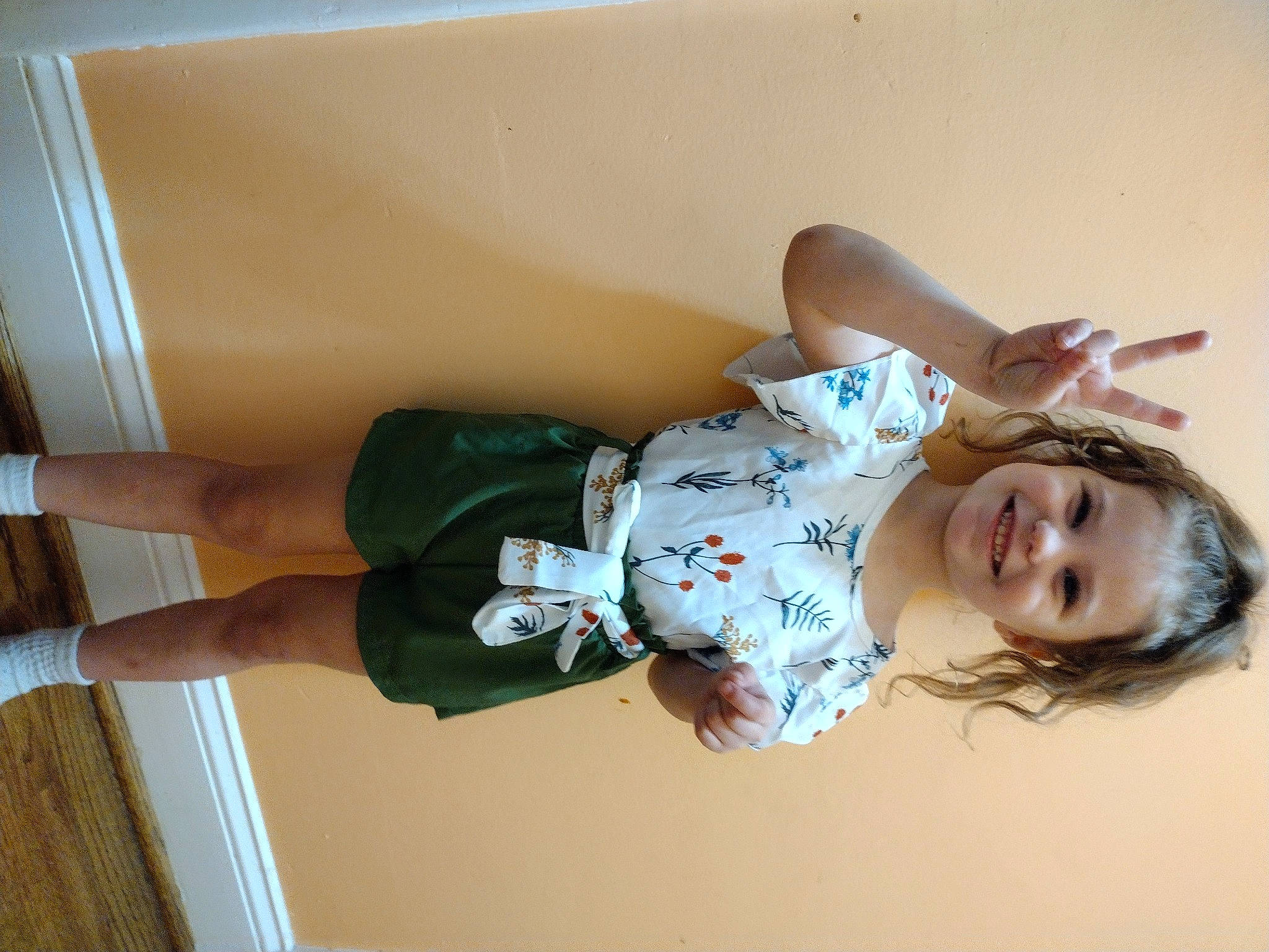 Maggie is registered to the contest to win money with this photo: baby, baby_toddler_clothing, child, comfort, elbow, fun, happy, human_leg, joy, knee, person, room, shoulder, sleeve, smile, sock, stairs, thigh, toddler, waist
