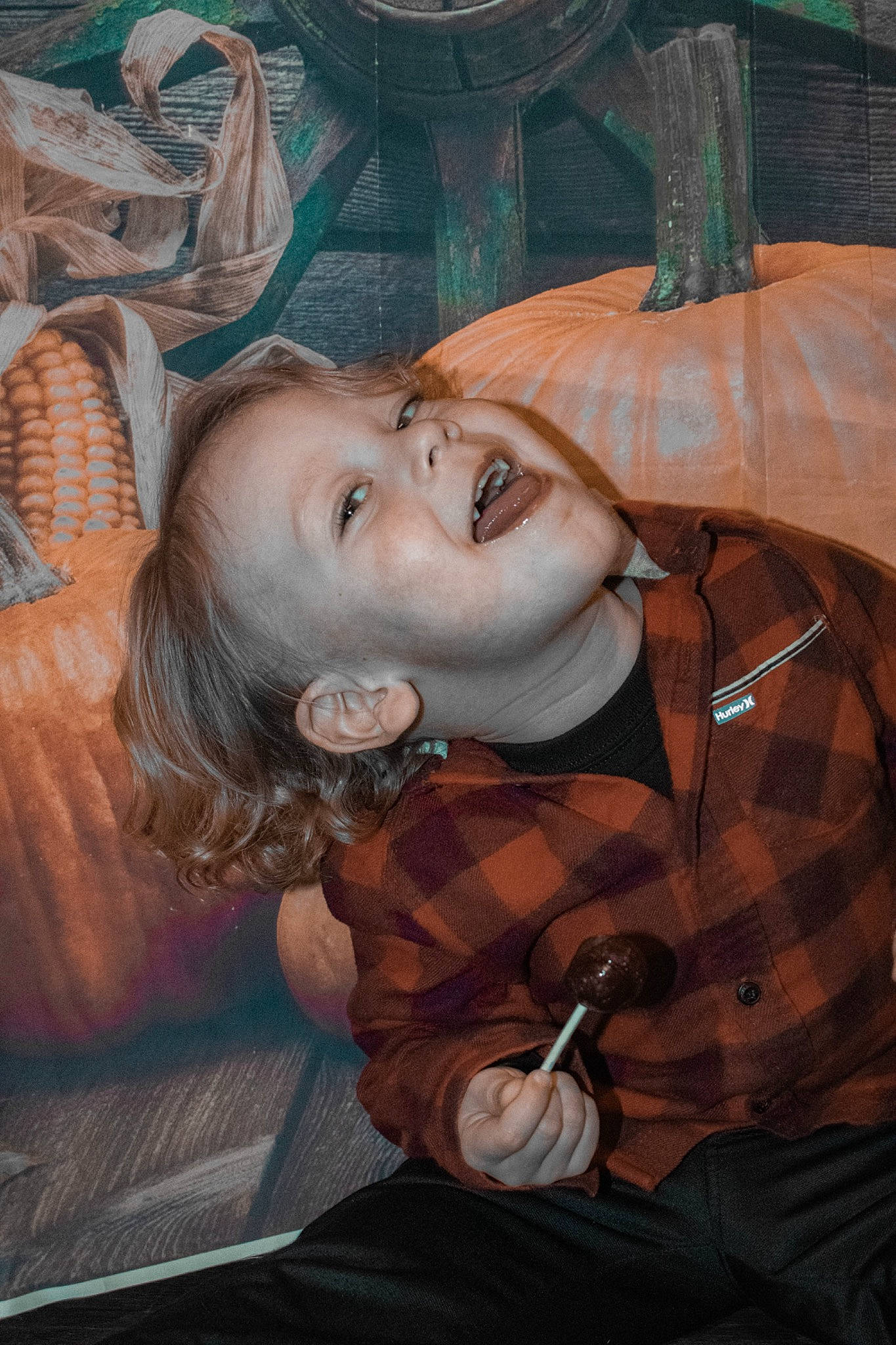 Hayden is registered to the contest to win money with this photo: art, artist, cheek, child, cool, drawing, eyelash, fun, mouth, mural, paint, painting, pattern, person, plaid, portrait, sitting, tartan, textile, visual_arts