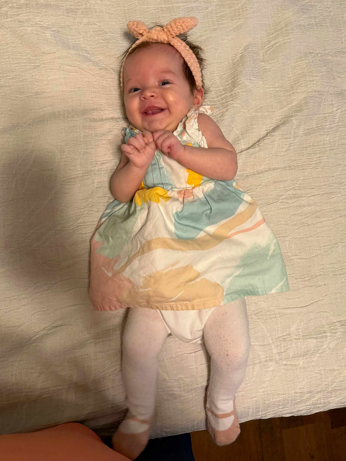 Harper joined the competition — help win amazing prizes! baby, smiling, headband, dress, tights, infant, lying_down, blanket, cute, happy, portrait, pastel_colors, child, indoor, young_child, clothing, person, baby_girl, fabric, soft_texture