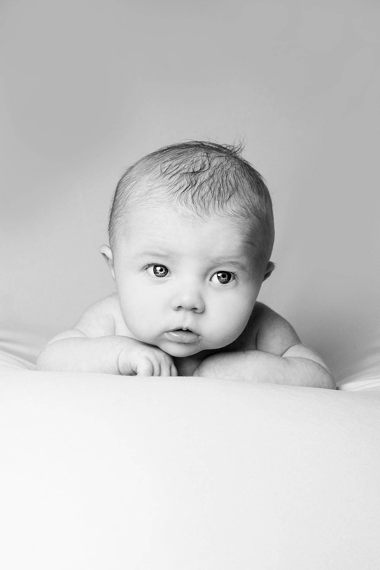 Jack is registered to the contest to win money with this photo: arm, baby, cheek, chin, close_up, comfort, eye, eyebrow, eyelash, flash_photography, flooring, happy, head, iris, lip, monochrome_photography, nose, person, stomach, toddler
