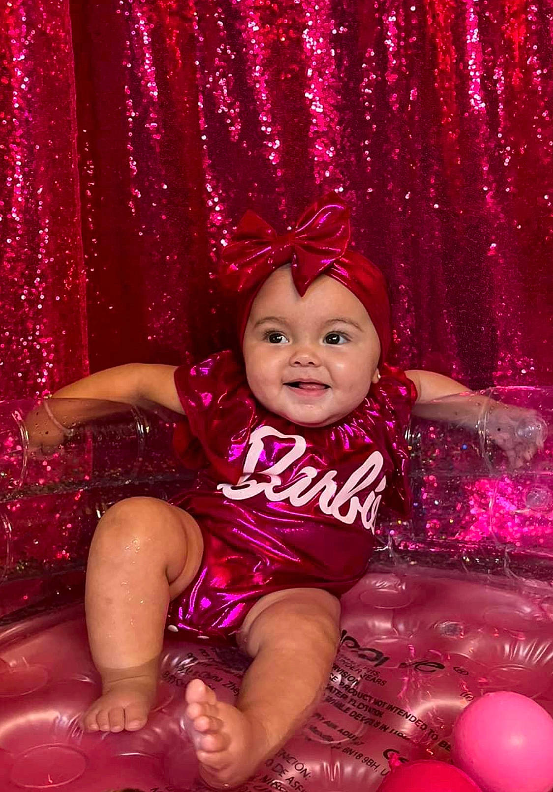 Milysha is registered to the contest to win money with this photo: baby_toddler_clothing, beauty, child, curtain, event, flash_photography, fun, happy, headwear, joy, leisure, lighting, magenta, person, photograph, pink, purple, red, sitting, smile