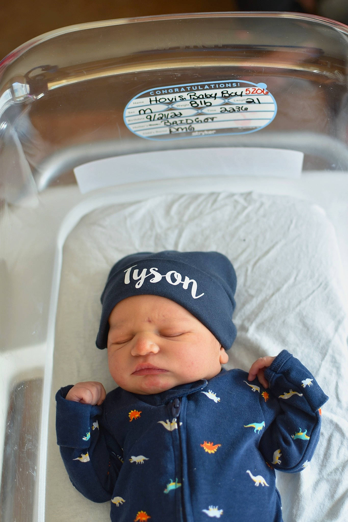 Tyson is registered to the contest to win money with this photo: baby, baby_products, baby_safety, baby_sleeping, baby_toddler_clothing, beanie, cap, child, cleanliness, comfort, headgear, headwear, pattern, person, sleeve, toddler, white, winter