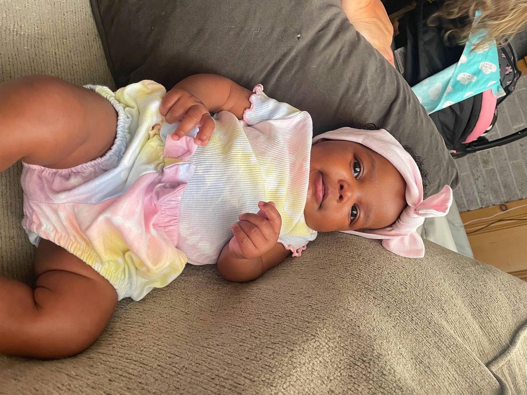 Camilla is registered to the contest to win money with this photo: baby, baby_products, baby_toddler_clothing, cheek, child, comfort, eye, finger, hand, hat, human_leg, knee, leg, mammal, mouth, person, sitting, skin, thigh, toddler