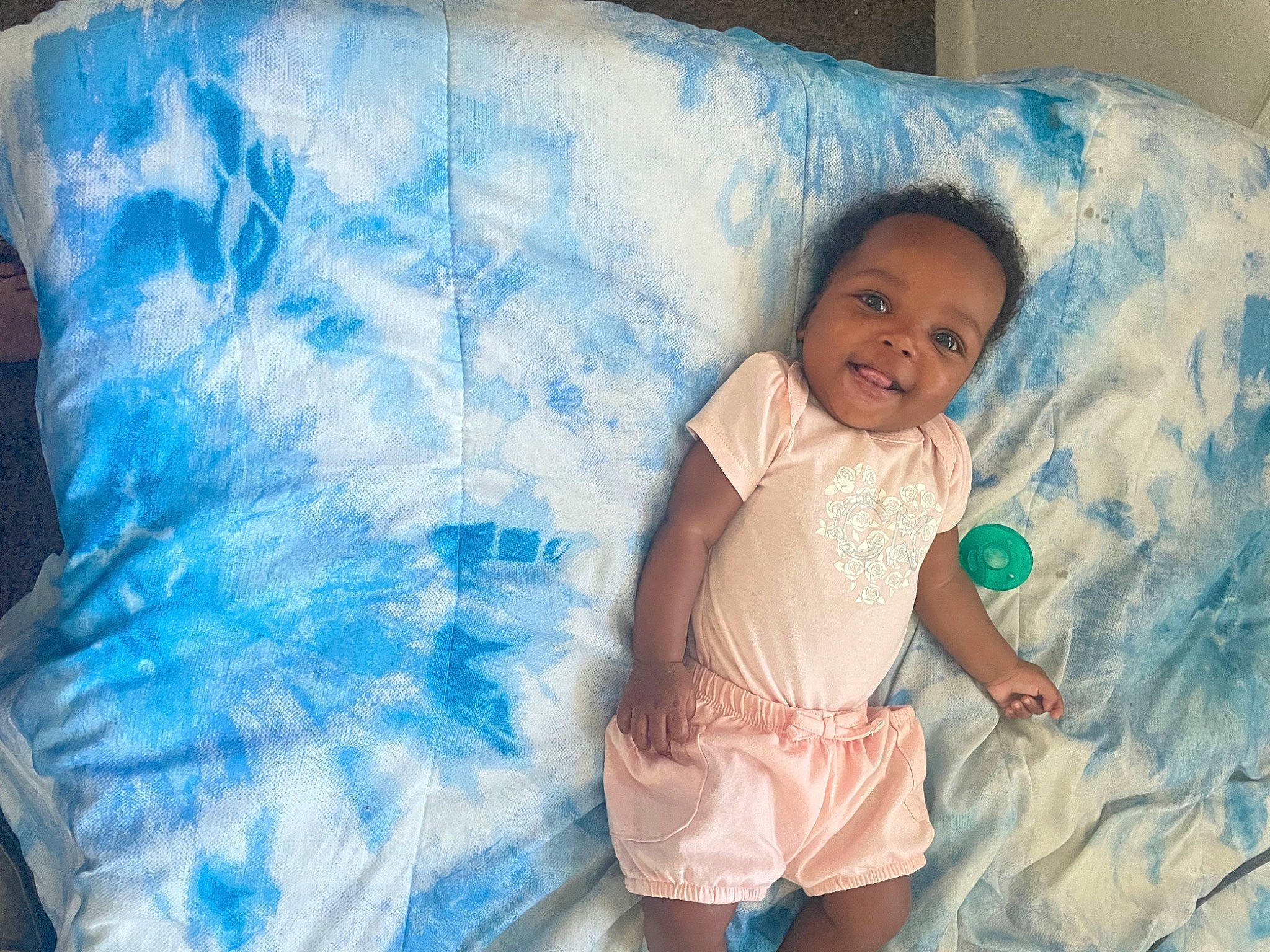 Camilla is registered to the contest to win money with this photo: aqua, azure, baby, baby_toddler_clothing, bedding, child, comfort, electric_blue, fun, happy, iris, joy, linens, pattern, person, pink, product, sleeve, smile, t_shirt