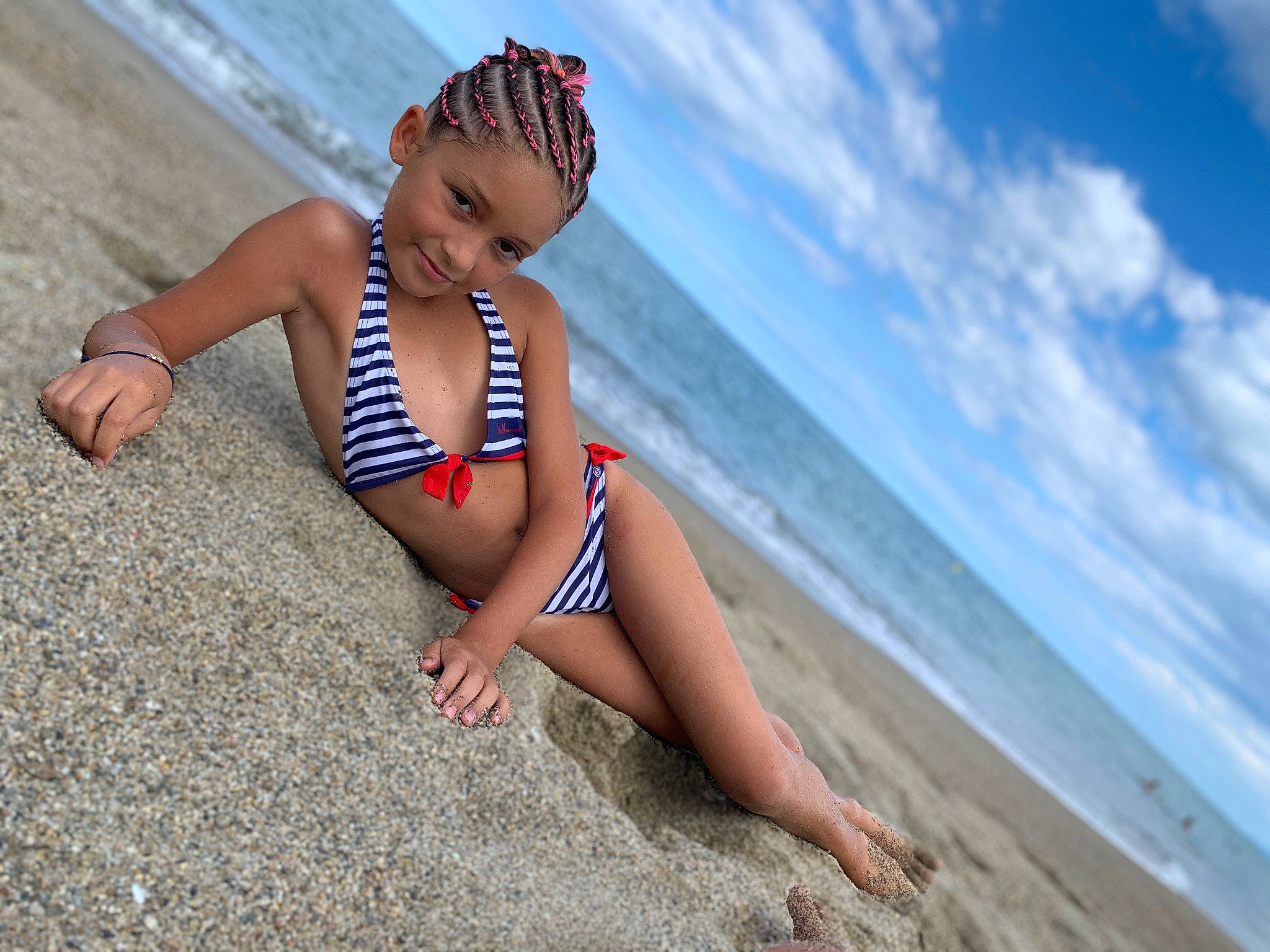 Tennessee participe au concours pour gagner de l'argent avec cette photo : beach, brassiere, cloud, flash_photography, happy, headwear, human_body, joy, knee, leg, leisure, lingerie, people_in_nature, people_on_beach, person, sky, swimsuit_top, swimwear, thigh, toddler