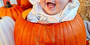 Everleigh joined the competition — help win amazing prizes! baby, pumpkin, orange_bow, fall, autumn, happy, smiling, costume, festive, decorations, blanket, cute, child, holiday, seasonal, portrait, indoors, colorful, playful, fun