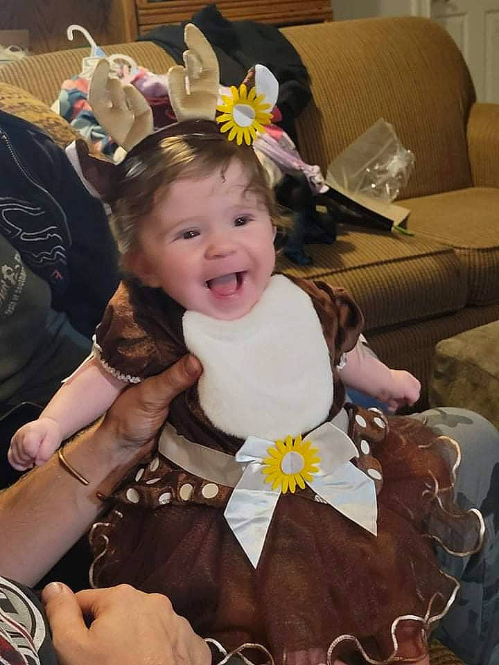 Rayna is registered to the contest to win money with this photo: child, couch, eye, flower, fun, hairstyle, happy, head, headpiece, human, iris, mammal, organ, person, plant, product, skin, smile, textile, toddler