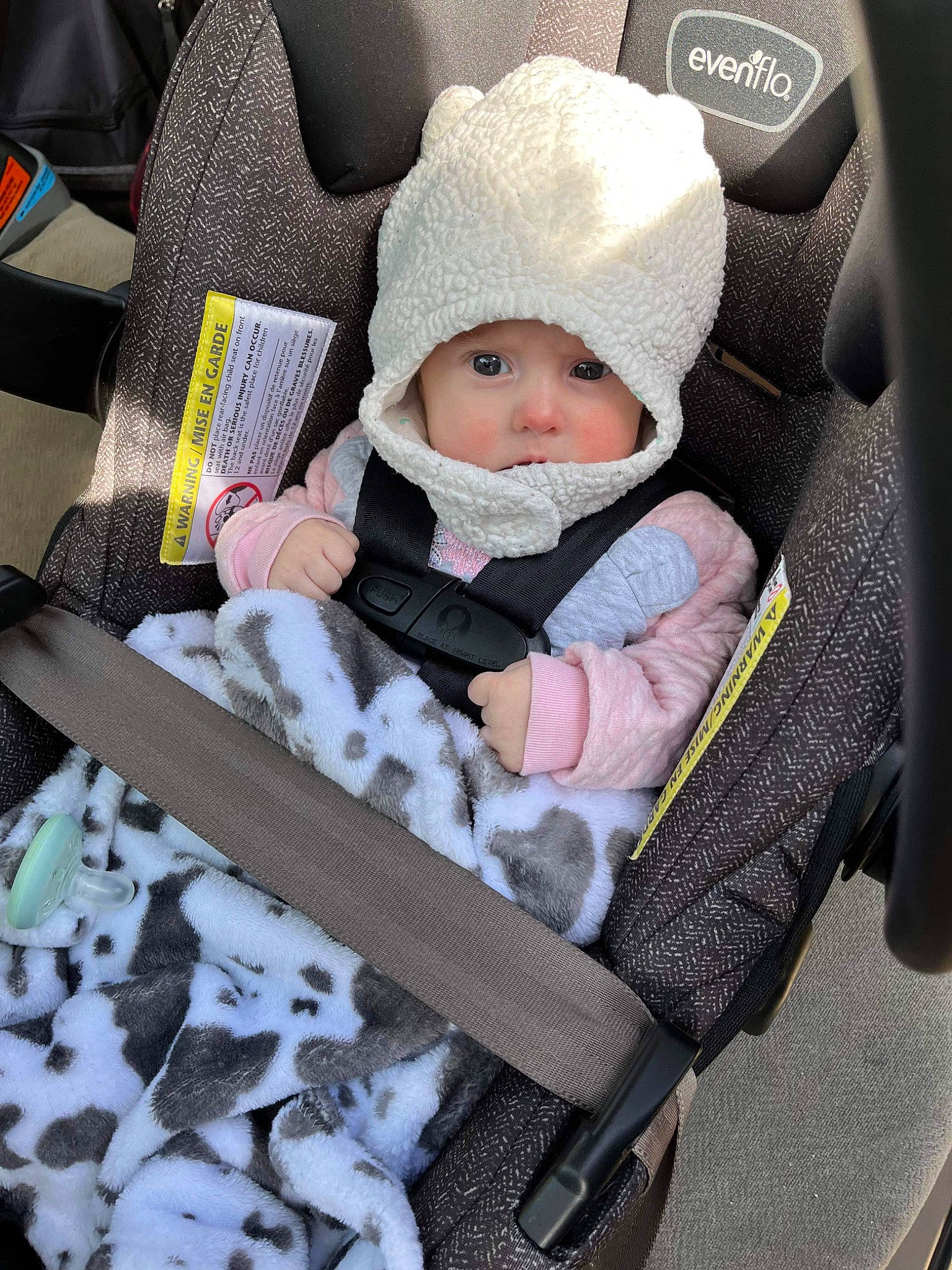Stella joined the competition — help win amazing prizes! baby, baby_carriage, baby_products, baby_safety, baby_toddler_clothing, beanie, cap, car_seat, child, comfort, headwear, linens, pattern, person, product, sitting, sleeve, toddler, white