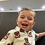 toddler, child, smiling, happy, shirt, pattern, teddy_bear, indoors, ceiling, light, hair, wet_hair, face, portrait, cute, buttoned_shirt, person, clothing, joy, expression