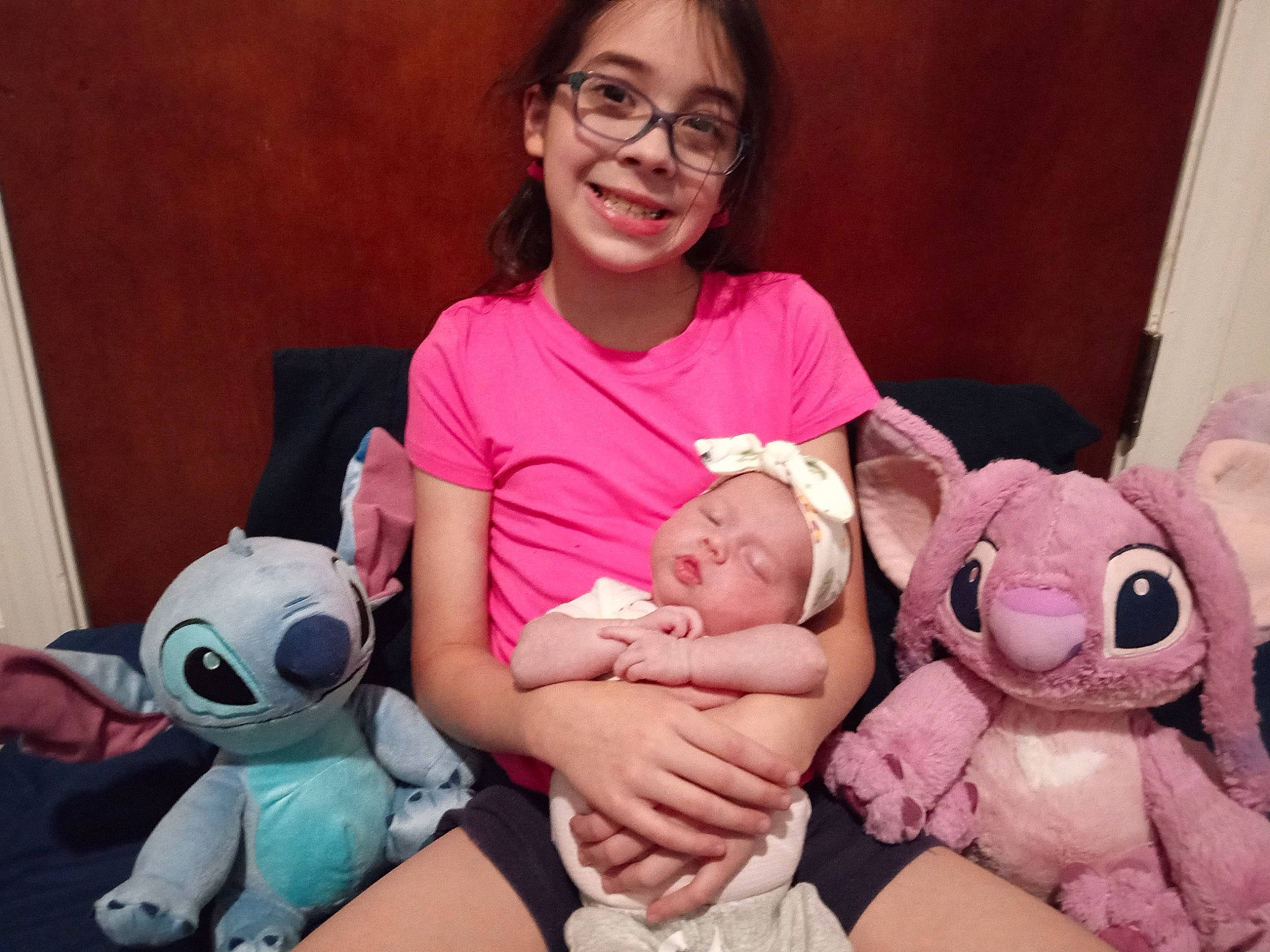 Emma joined the competition — help win amazing prizes! baby, baby_toddler_clothing, cheek, child, comfort, event, face, finger, fun, happy, head, joy, lap, mammal, person, pink, skin, smile, stuffed_toy, t_shirt