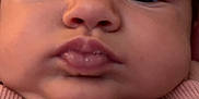 Raelynn is registered to the contest to win money with this photo: baby, face, close_up, child, expression, pink_shirt, wet_hair, pout, chubby_cheeks, portrait, person, infant, cute, skin, eyebrows, eyes, clothing, mouth, nose, young