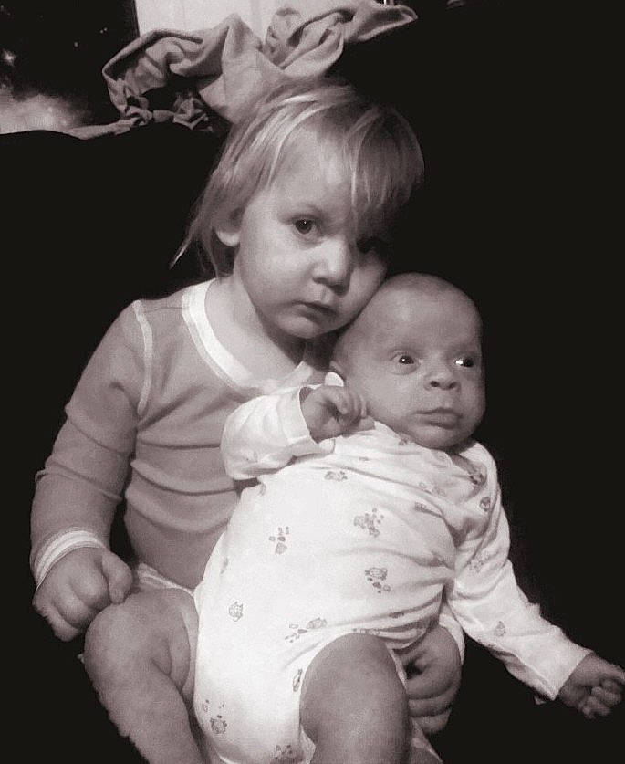 Finnigan is registered to the contest to win money with this photo: arm, black_and_white, cheek, dress, ear, facial_expression, flash_photography, gesture, hair, hand, happy, human, interaction, iris, mammal, mouth, nose, organ, person, smile