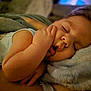 Leo is registered to the contest to win money with this photo: baby, sleeping, hand, face, pillow, blanket, cozy, infant, peaceful, closeup, skin, cute, child, soft, rest, indoors, nap, relaxation, portrait, comfort