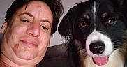 Locky participe au concours pour gagner de l'argent avec cette photo : woman, person, dog, berner_mountain_dog, selfie, portrait, indoors, couch, fluffy, long_hair, black_white_brown, tongue, happy, smiling, face, pet, companion, pink_shirt, close_up, photography