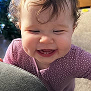 Bonnie joined the competition — help win amazing prizes! baby, carpet, child, christmas_tree, closeup, couch, cozy, curly_hair, cute, decor, face, furniture, happy, holiday, indoors, living_room, person, pink_clothing, smiling, teeth