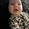 Ravynn joined the competition — help win amazing prizes! baby, infant, child, leopard_print, onesie, smiling, face, hand, cute, happy, portrait, indoor, person, young, expression, clothing, skin, head, eyes, mouth