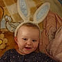Paisley joined the competition — help win amazing prizes! baby, blanket, bunny_ears, child, cute, face, happy, indoors, infant, knitwear, lying_down, patterned, person, plush, smile, soft, toddler, toy, warm, young