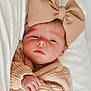 Presley is registered to the contest to win money with this photo: baby, infant, bow, headwear, knit_sweater, sleepy, blanket, closeup, portrait, cute, child, soft_texture, warm, indoor, hand, face, newborn, cozy, fashion, toddler